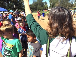 Valley Center Primary teacher Kathy Wollman keeps her second graders, including David Manriquez, under her left arm, in line.