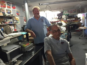 Steve Waldron, Cruisn' Grand founder, standing, and Bill Lane at Top End Tee's.