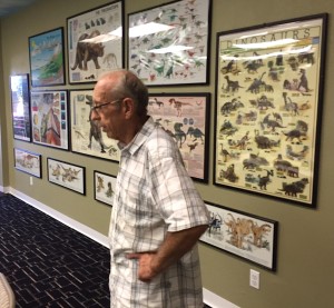 Keith Roynon surveys some of the materials in one of the museum education rooms.