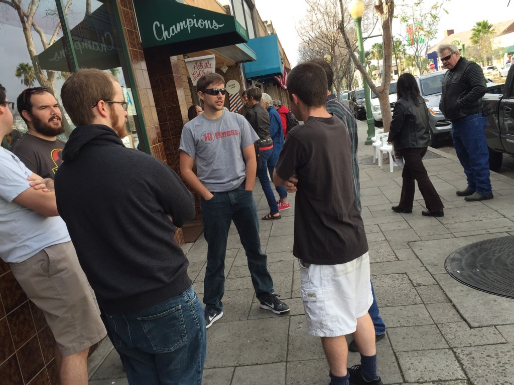 Escondido student Doug Burnham, front right and friend Steven Wade, front left, wait patiently with group for a large table to open.