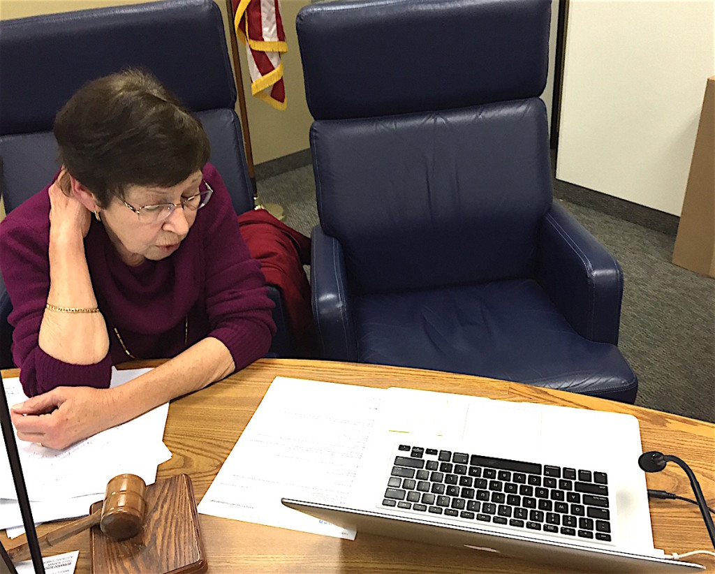 EUSD Board president Joan Gardner speaks to exiled trustee Jose Fragozo via computer line during meeting recess.