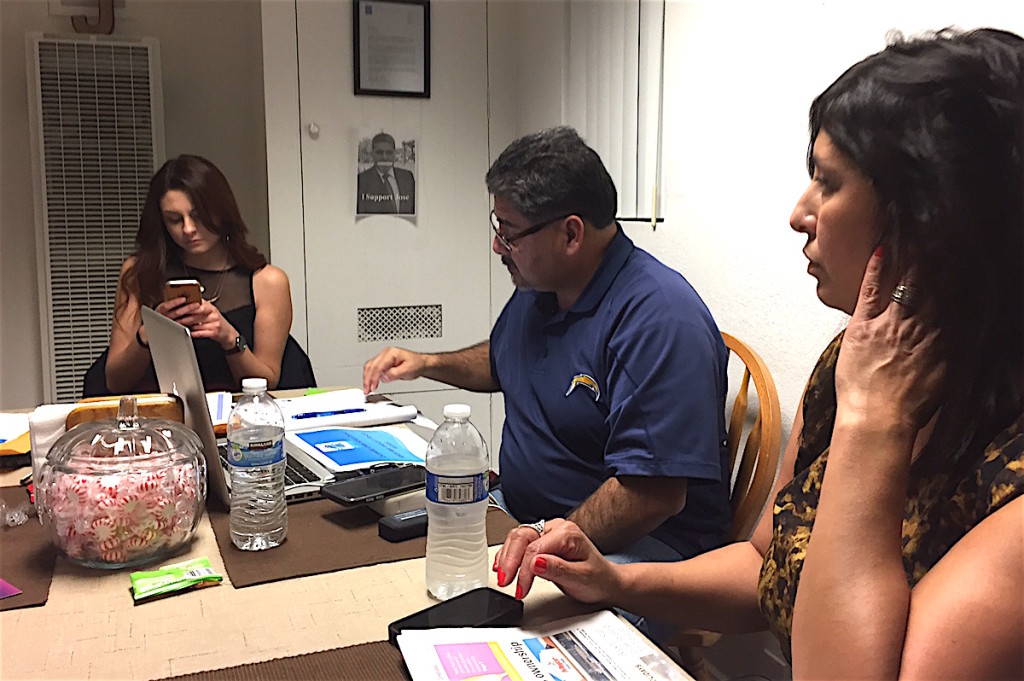 EUSD Board member Jose Fragozoo at a residence two miles away from the meeting with Carmen Miranda-Griffith, right and Miranda Griffith, left.