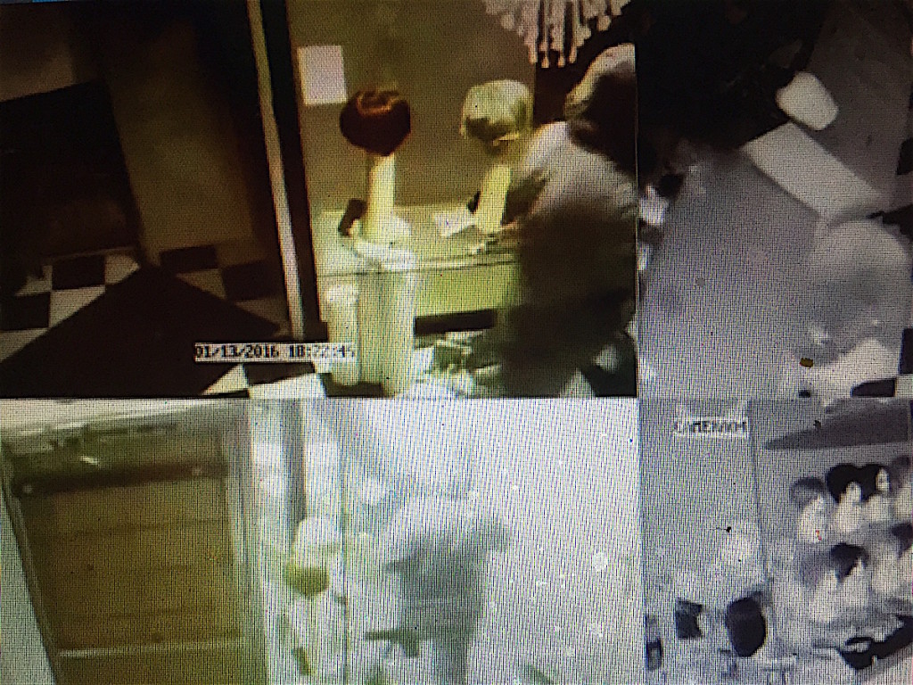 Surveillance camera shots of early Wednesday robbery at HG Wigs TOO.