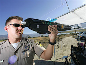 Los Angeles Sheriff's Department sergeant checks out a drone.