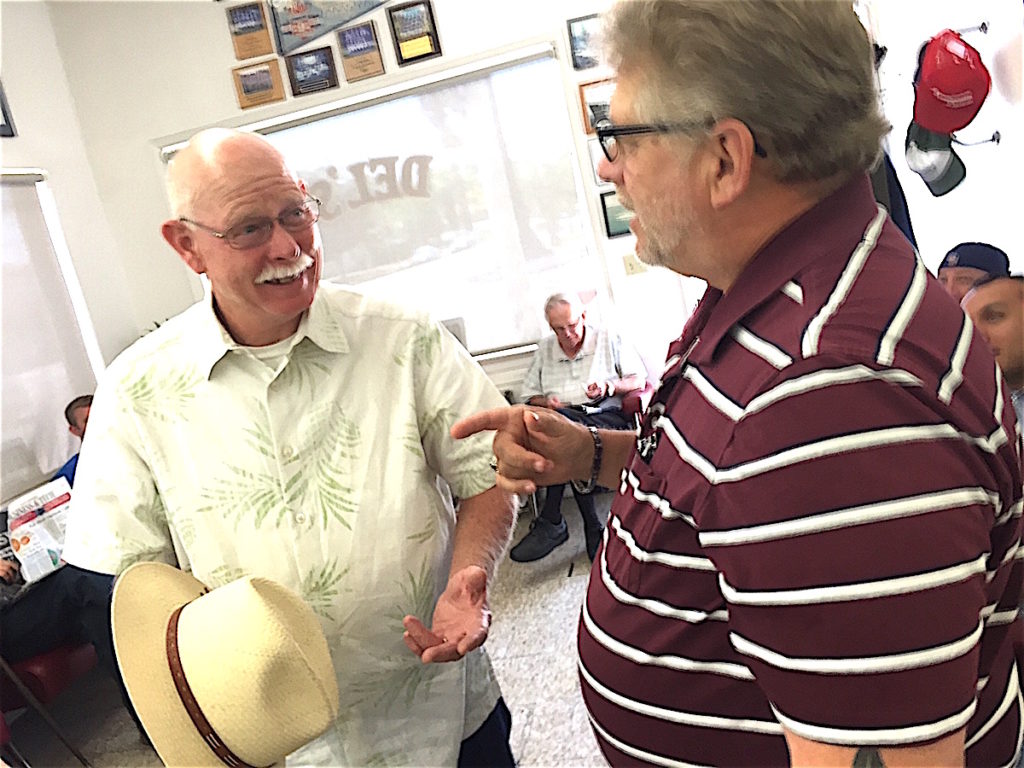 Dan Engelbrecht, left, with long0time -- and who isn't --customer Mike Sherman.