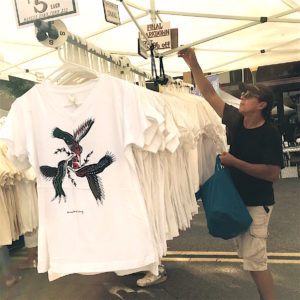 Beverly Hills artist and T-shirt designer John A. Conroy takes care of business for the last time.