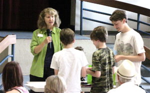 Cindy Bathgate recognizes volunteers Aedyn Loefke, Devyn Loefke and Trysten Loefke.