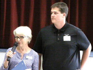 Scholarship Chair Helen Borchelt introducing Harrison Bauer.